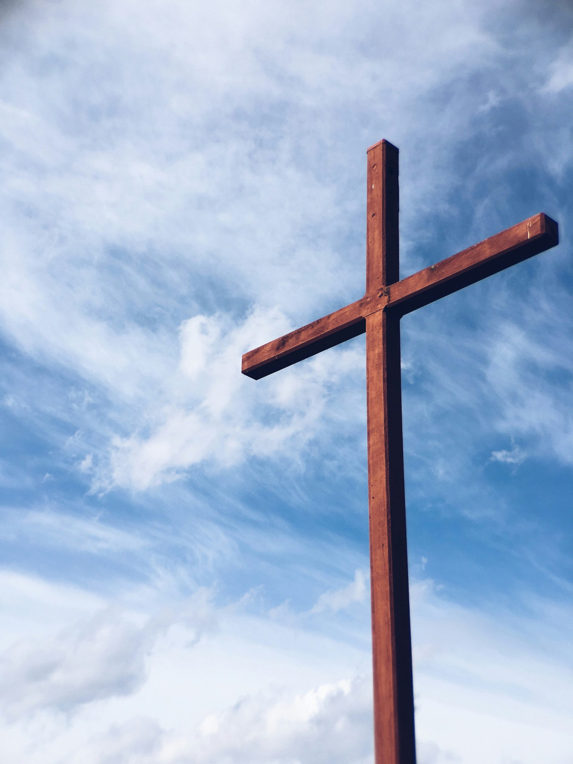 A wooden cross at sunrise, symbolizing the journey of Lent and Christ's sacrifice.